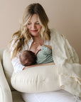 newborn baby breastfeeding on snuggle me organic feeding support nursing pillow natural