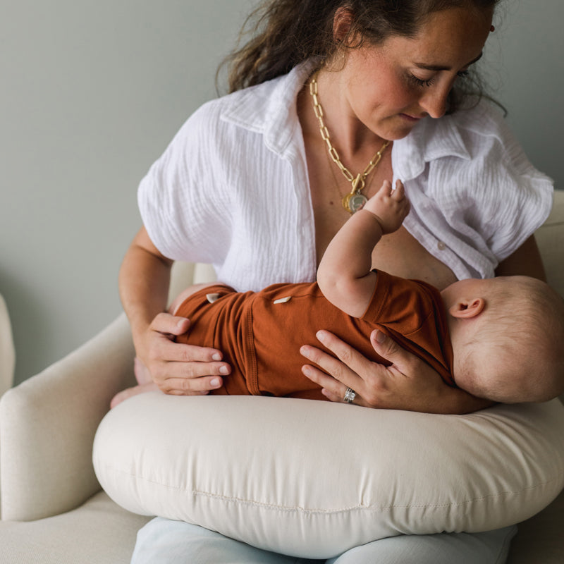 baby breastfeeding on snuggle me organic feeding support nursing pillow natural