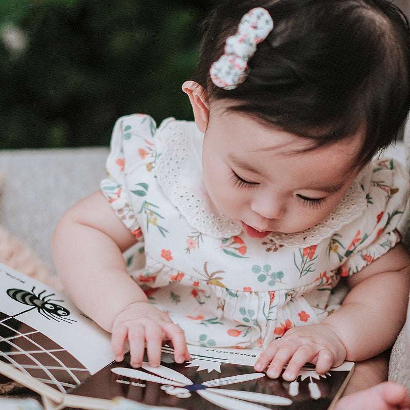 baby elsie wearing purebaby organic blooms romper christmas collection organic cotton baby clothes