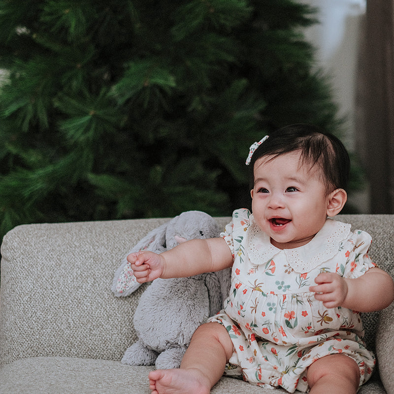 baby elsie wearing purebaby organic blooms romper christmas collection organic cotton baby clothes