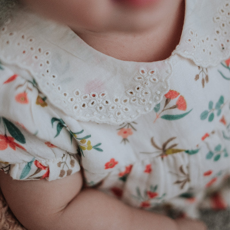 baby elsie wearing purebaby organic blooms romper christmas collection organic cotton baby clothes