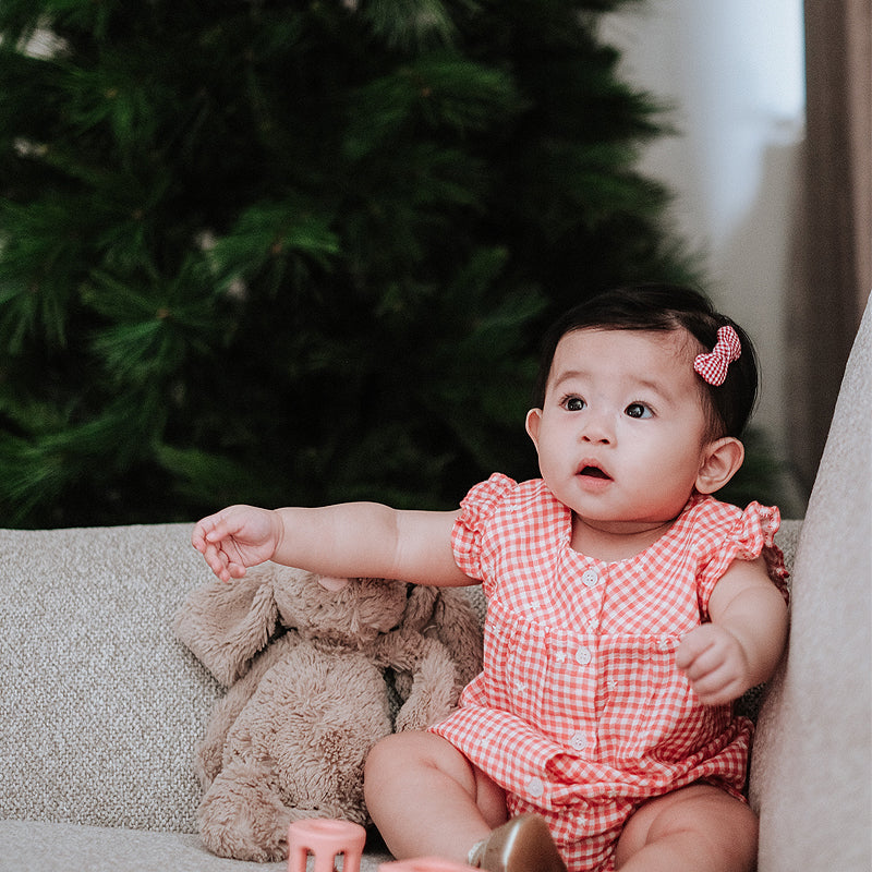 baby elsie wearing purebaby organic festive bodysuit christmas collection organic cotton baby clothes