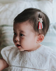 baby elsie wearing purebaby organic christmas hair bow clip