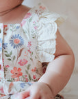 baby elsie wearing purebaby organic geranium floral romper organic cotton baby clothes