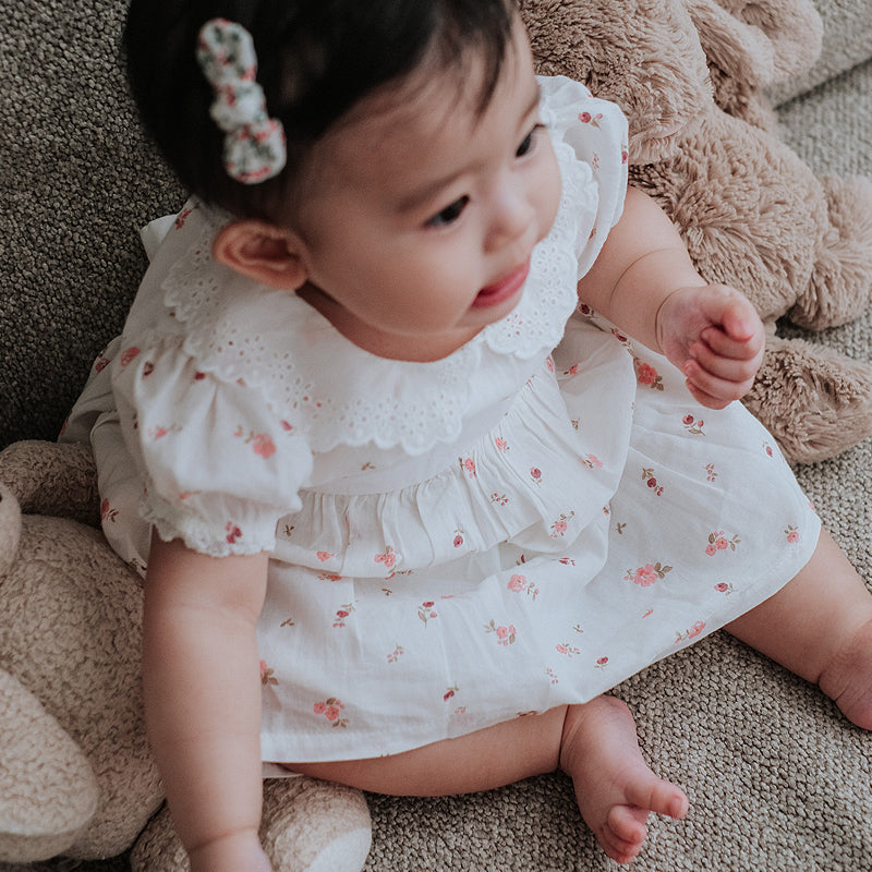 baby elsie wearing purebaby organic rosebud dress special occasion organic cotton clothes