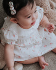 baby elsie wearing purebaby organic rosebud dress special occasion organic cotton clothes