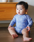 baby elsie wearing purebaby organic blue daisy baby swimwear